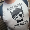Model wearing Dead Inside Still Horny graphic tee